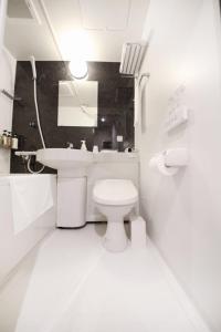 Vonios kambarys apgyvendinimo įstaigoje Toho Hotel