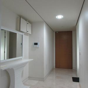 a hallway with a sink and a door at Exclusive The Troika Luxury Apartment in Kuala Lumpur