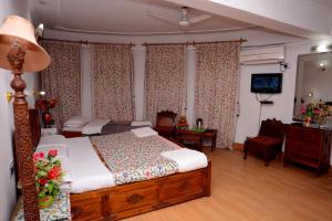 Voodi või voodid majutusasutuse Hotel Centre Point toas