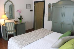 Postel nebo postele na pokoji v ubytování Hotel Miramare