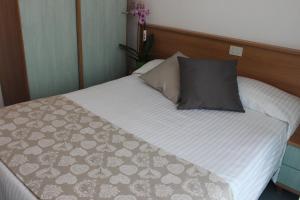 Postel nebo postele na pokoji v ubytování Hotel Miramare