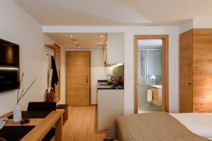 TV a/nebo společenská místnost v ubytování EVA Serviced Apartments