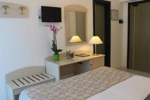 Postel nebo postele na pokoji v ubytování Hotel Miramare