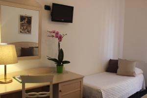 Postel nebo postele na pokoji v ubytování Hotel Miramare