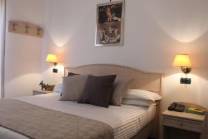 Postel nebo postele na pokoji v ubytování Hotel Miramare