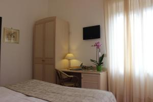 Postel nebo postele na pokoji v ubytování Hotel Miramare