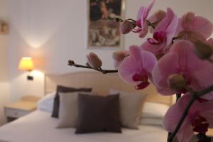 Postel nebo postele na pokoji v ubytování Hotel Miramare