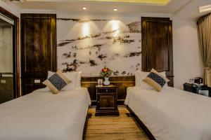 En eller flere senger på et rom på Delta Sapa Hotel
