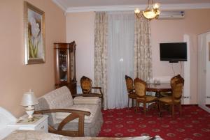 a living room with a couch and a table at Nelly Apart in Kyiv