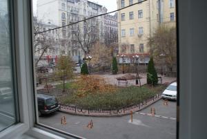 a view from a window of a street with cars at Nelly Apart in Kyiv