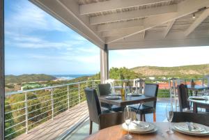 a dining room with a view of the ocean at The Quarter Deck in Kenton on Sea
