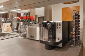 a coffee maker on a counter in a kitchen at Romantic Apartment Prague near Charles Bridge in Prague