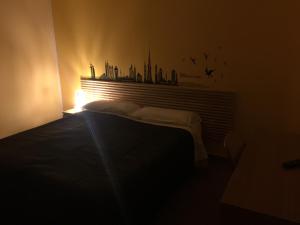 Letto o letti in una camera di Albergo Conca D'Oro