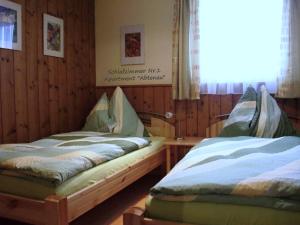 מיטה או מיטות בחדר ב-Apartment Dreier - Salzburger Land