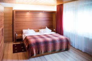 Postel nebo postele na pokoji v ubytování Hotel La Villa