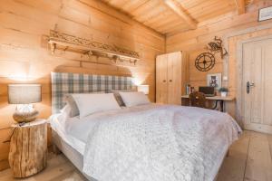 Postel nebo postele na pokoji v ubytování Apartamenty Biały Potok