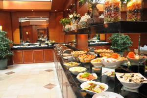 a buffet line with a lot of food on display at Hotel Midi in Ankara