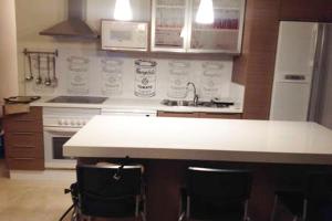 A kitchen or kitchenette at Apartamento en Playa de las Burras
