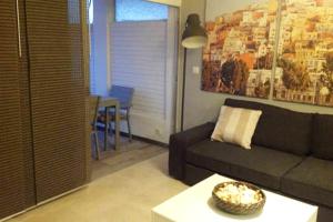A seating area at Apartamento en Playa de las Burras