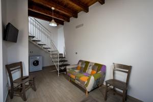 a living room with a couch and two chairs at Casa Vacanza Saraceno in Castellammare del Golfo