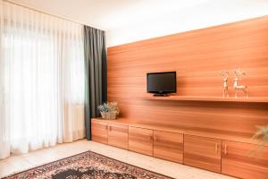 TV a/nebo společenská místnost v ubytování Hotel La Villa