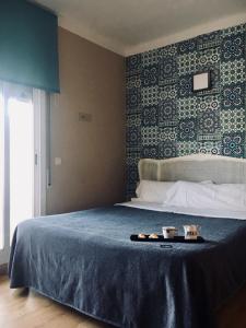 Ένα ή περισσότερα κρεβάτια σε δωμάτιο στο Hotel 139