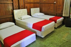 Ένα ή περισσότερα κρεβάτια σε δωμάτιο στο RedDoorz Hostel @ Dago 2