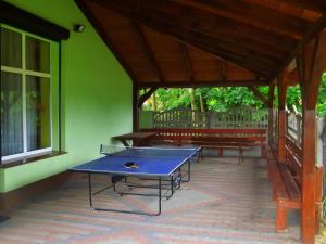 a ping pong table sitting inside of a building at Agrotourist Maryska Małe Leźno in Małe Leżno