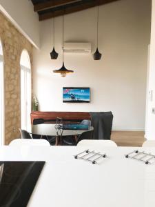 a dining room with a table and a piano at Alicante old city & beach appartment in Alicante