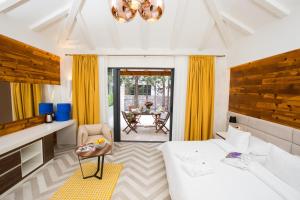 a living room with a white couch and a table at Villa Diamond in Mlini +123 photos