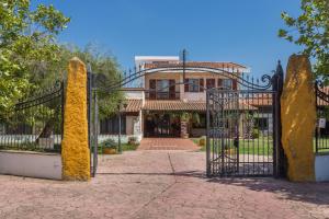 an entrance to a house with a wrought iron gate at Da Renzo in Siamaggiore