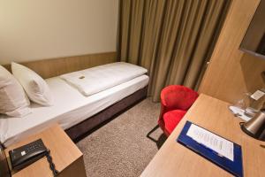 Postel nebo postele na pokoji v ubytování Astor & Aparthotel