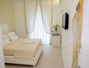A bed or beds in a room at B&B Pompei Passion