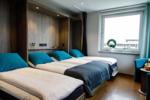 Llit o llits en una habitació de Hotell Nissastigen