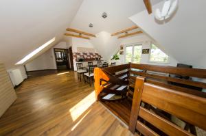 an empty church with wooden benches and tables at Villa Hof in Luboń