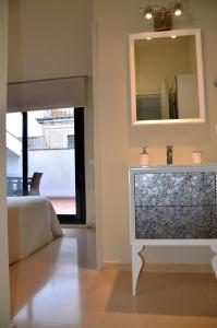 a bedroom with a bed and a mirror on the wall at Apartamento playa Costa Barcelona in Malgrat de Mar +52 photos