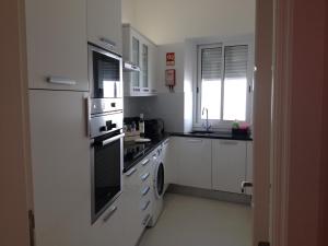 Kuchyň nebo kuchyňský kout v ubytování Cândido Reis Apartments