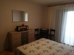 Postel nebo postele na pokoji v ubytování Apartman Buble