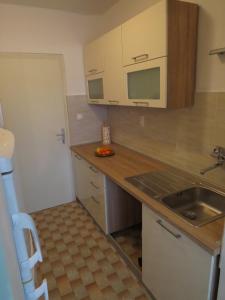 Kuchyň nebo kuchyňský kout v ubytování Apartman Buble