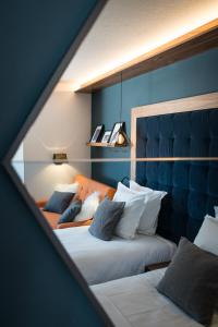 Un pat sau paturi într-o cameră la Fahrenheit Seven Val Thorens