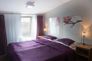 Posteľ alebo postele v izbe v ubytovaní Hotel Secesja