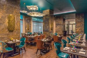 a row of tables and chairs in a restaurant at The Jung Hotel and Residences in New Orleans