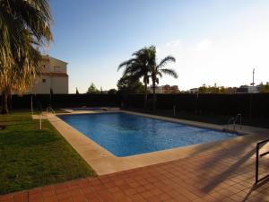 a swimming pool in the yard of a house at Arenal Golf in Benalmádena