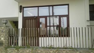 a front door of a house with a fence at Paradise Villa in Vrindāvan