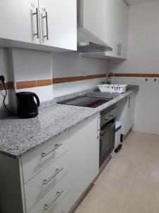 A kitchen or kitchenette at Apartament Lazurowy