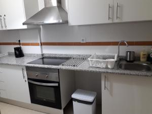 A kitchen or kitchenette at Apartament Lazurowy
