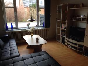 a living room with a couch and a coffee table at Klarskov Bed & Breakfast in Klarskov