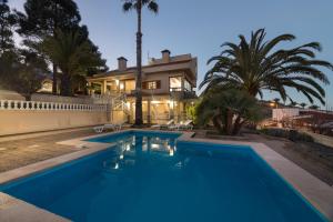 a large swimming pool in front of a house at Teresita High Views with private pool in Santa Brígida