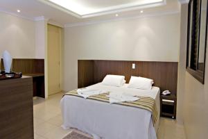 Postel nebo postele na pokoji v ubytování Hotel 2 Gauchos