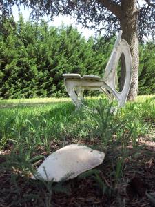 a toilet sitting in the middle of a grassy field at Les Jardins du Forez in Montrond-les-Bains